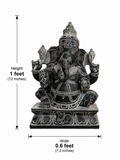 Hand-carved 1 ft Siddhi Ganesha statue in polished black stone shown beside an adult model for scale with measurements.