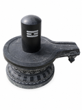 Hand-carved 2.9 ft Shiva Lingam with Ornate Carved Pedestal in natural Charnockite stone, product view 5 showing the sculpture and carved details.