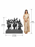 Hand-carved 3.5 ft Rama, Lakshmana and Sita statue set in polished black stone shown with an adult model for scale.
