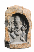 Hand-carved 3.9 ft Dancing Ganesha Boulder Statue in natural Charnockite stone, product view 4 showing the sculpture and carved details.