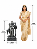 Hand-carved 3 ft Dasharathi Rama statue in polished Charnockite black stone shown beside an adult model for scale with measurements.