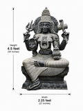 Hand-carved 4.5 ft Mahadevi statue in polished Charnockite stone shown beside an adult model for scale with measurements.