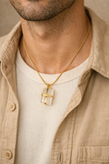 man wearing white moonstone pendant minimal jewelry